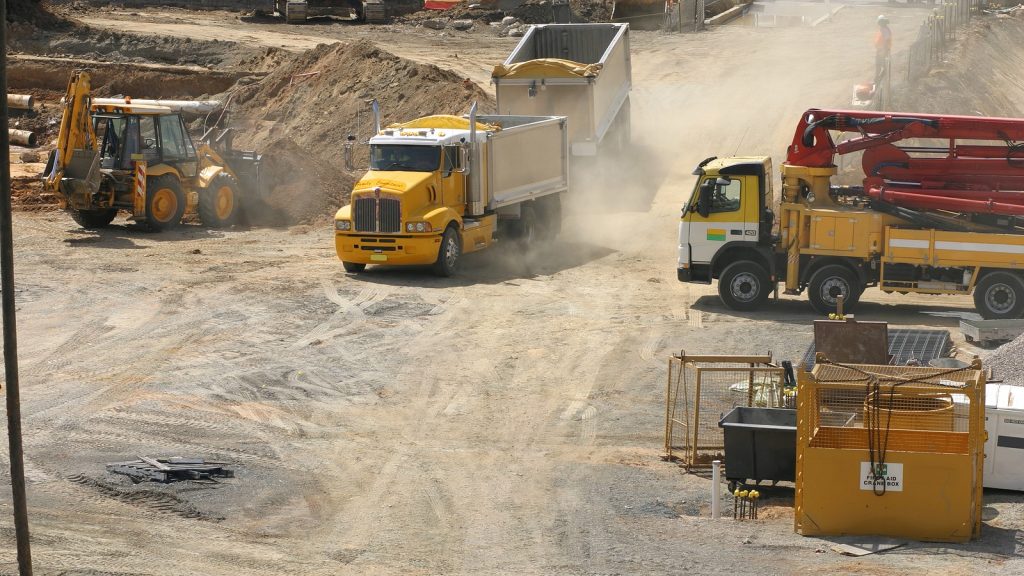 Trucks moving dirt on a construction site