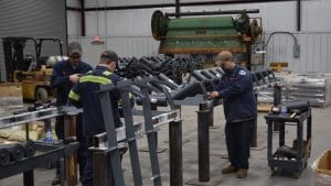 engineers working with conveyor idlers